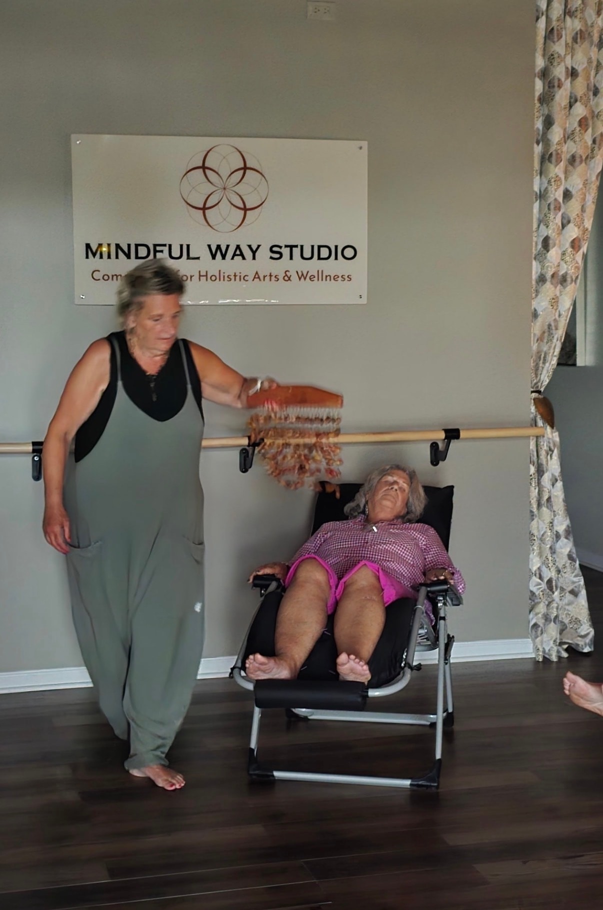 Reiki energy healing session at Mindful Way Studio Mokena IL — practitioner performing energy work over reclining client