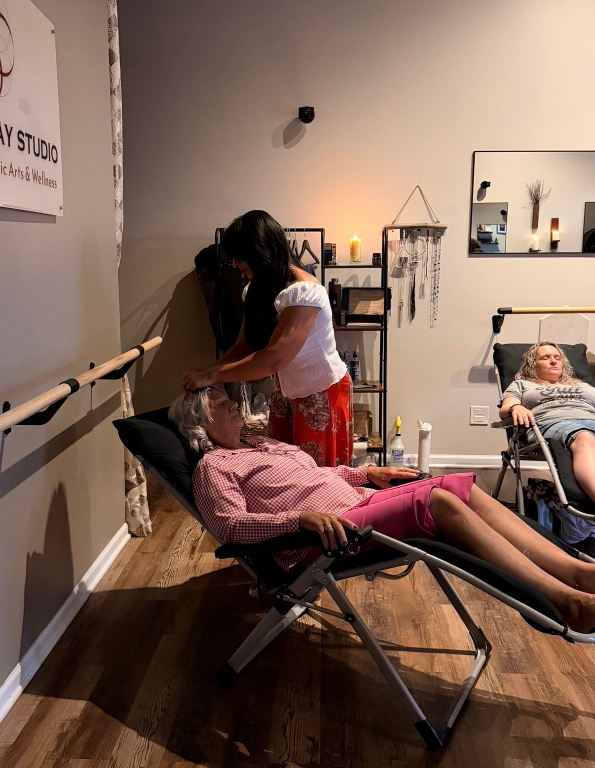 Acupuncture session in progress at Mindful Way Studio Mokena IL — practitioner working on relaxed client in zero-gravity chair