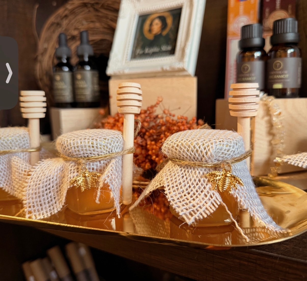 Artisanal honey jars and essential oils on a gold tray at Mindful Way Studio wellness boutique, Mokena IL