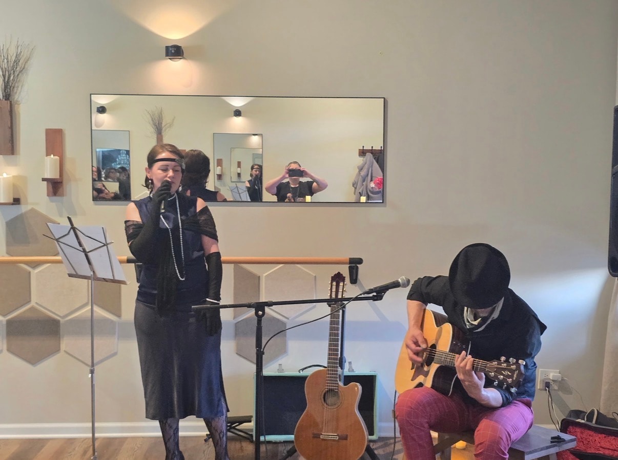 Live music performance at a Gatsby-themed private wellness party