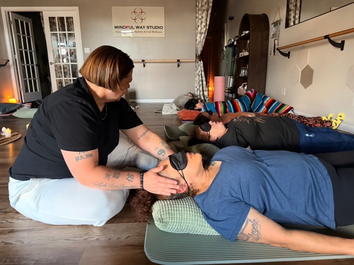 Hands-on energy healing session at a Mindful Way Studio event