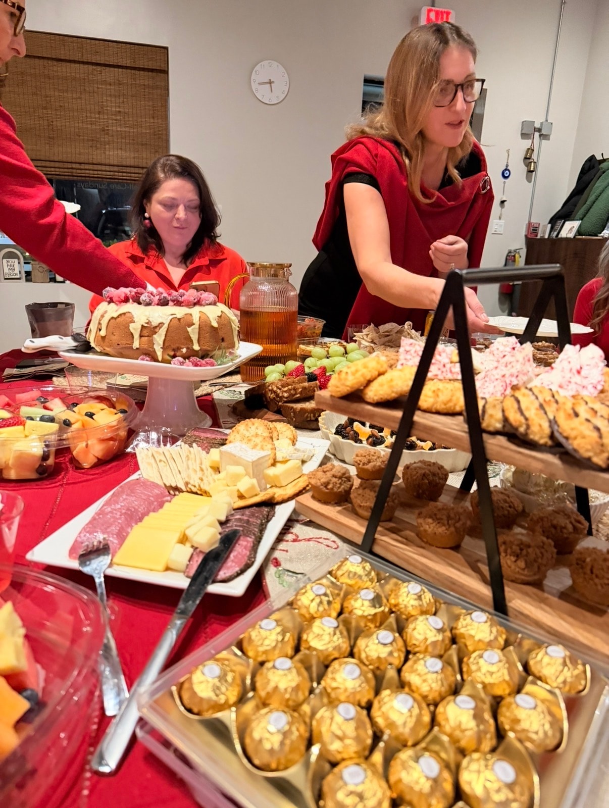 Holiday feast spread with bundt cake, charcuterie and treats