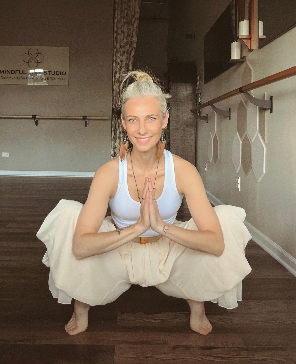 Ania in yoga squat prayer pose at the Mindful Way Studio barre