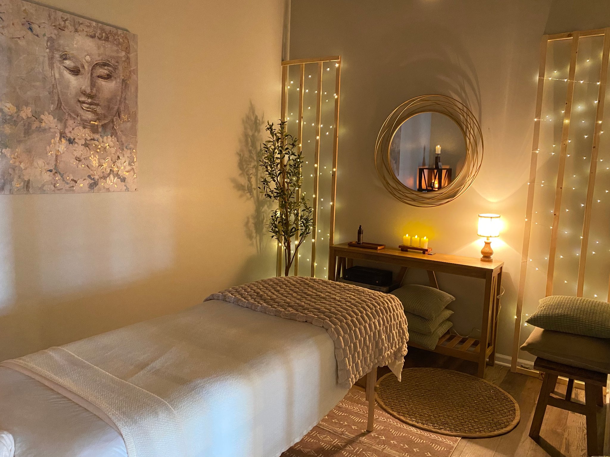 Mindful Way Studio treatment room with warm candlelight and fairy lights
