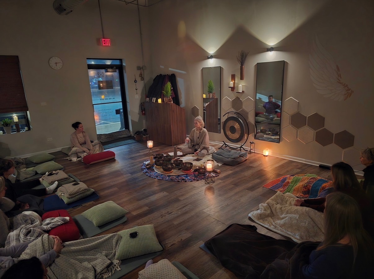 Ania Haas leading a candlelit holistic arts circle with singing bowls at Mindful Way Studio in Mokena IL